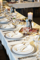 Nicely served New Year's table in the restaurant. Christmas night in a cafe or at home. Stock photo for design