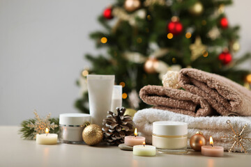 Obraz na płótnie Canvas spa composition on the table and Christmas accessories. Relaxation care products. Skin care