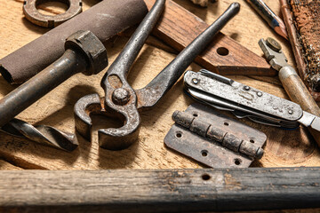 Old vintage household hand tools still life on a wooden background in a DIY and repair concept