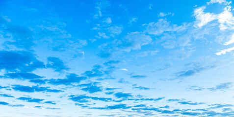 Naklejka na ściany i meble Blue morning sky with blue and white clouds