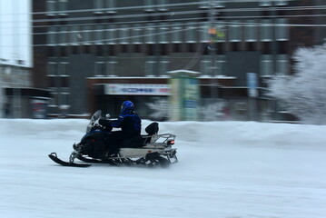 Sports competitions in the North of Russia Snowmobiling on the road. The City Of Vorkuta