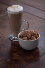 Latte and brown sugar cubes