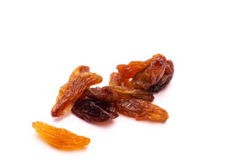 Several dark yellow raisins on a white background