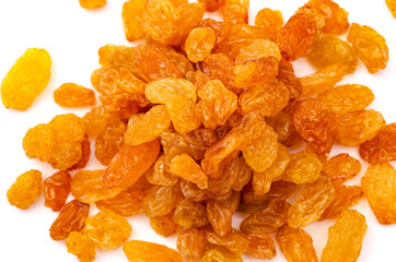 A slide of appetizing yellow raisins on a white background