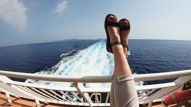 sexy young woman legs relaxing on cruise ship travel holiday