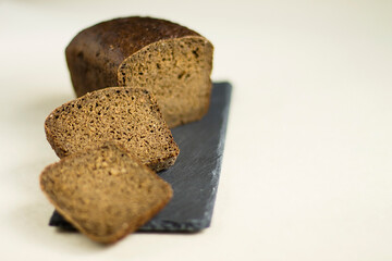 chopped black bread on a board
