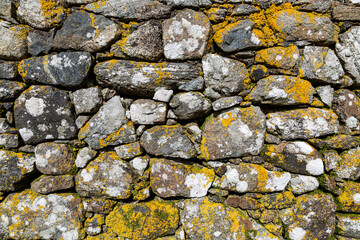 A Full Frame Photograph of a Textured Old Stone Wall