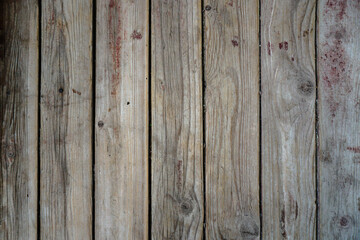 Old board in erased paint. Wooden wall of an old building. Background for design.