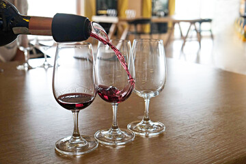 Wine glasses display at winery. Close up, copy space, background.