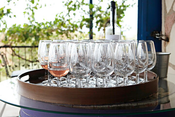 Wine glasses display at winery. Close up, copy space, background.