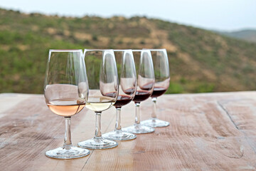Wine glasses display at winery. Close up, copy space, background.