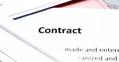 Close-up of contract among colorful graphics.Business concept.