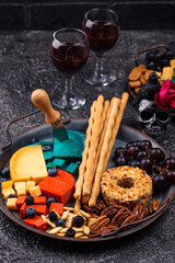 Halloween appetizers. Cheese plate with snacks