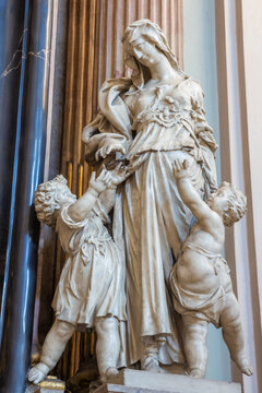 VIENNA. AUSRIA - JULY 27, 2013: The statue of  cardinal virtue Charity  from baroque church Maria Treu. Church was build between years 1698 bis 1719 by plans of architect Lukas von Hildebrandt
