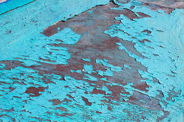 aged peeling blue color paint texture on wooden surface 