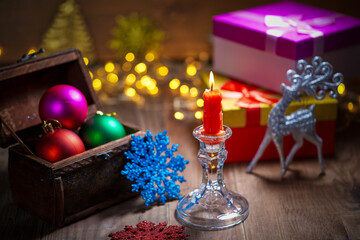 Beautiful silver reindeer toy on the background of Christmas toys.