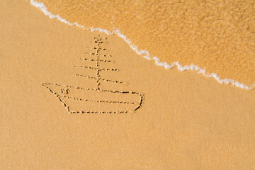 Fototapeta premium Painted sailboat on the sea sand