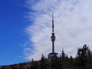 Fototapeta premium transmitter tower on Praděd with beautiful blue and white sky on an autumn sunny day, Jeseníky Mountains, Czech Republic, travel