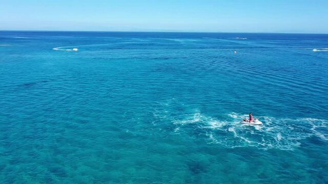 Fly boarding and sea riding in a sunny summer day, Zakynthos, Greece