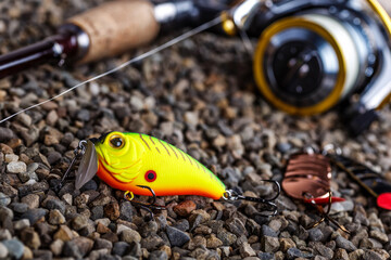 Fishing theme.Fishing tackle - fishing spinning, lures and wobblers.Closeup of a fishing box with...