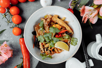 Udon noodles with chicken and peppers - Japanese cuisine