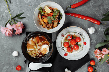 three-course business lunch. cherry tomatoes with tofu mousse, thai rice with chicken and vegetables, asian noodle soup, ramen with chicken