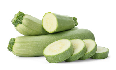 Cut and whole green ripe zucchinis on white background