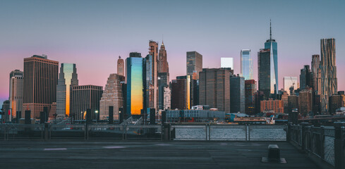 city skyline at sunset sunrise New York views panoramic buildings sun reflections downtown cityscape 