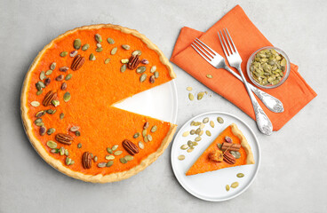 Delicious homemade pumpkin pie on light table, flat lay