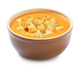 Tasty creamy pumpkin soup with croutons and seeds  in bowl on white background