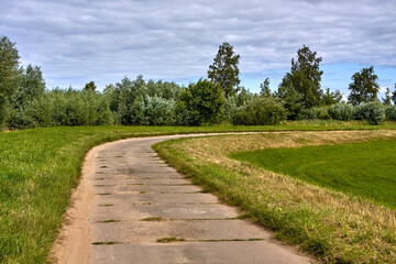 Fototapeta na wymiar Concrete slab road along in rural area.