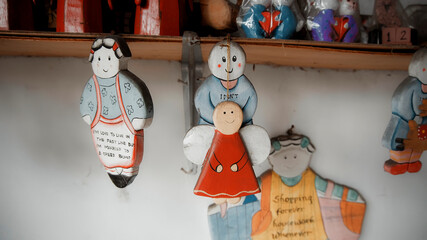 A lot of little different Christmas toys hanging on a thread