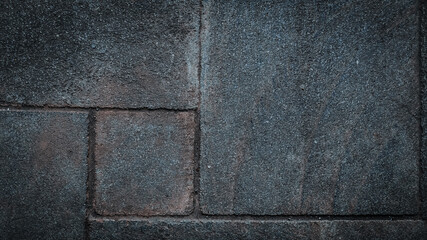 Dark textured stone tile Background