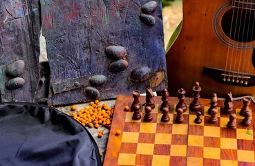 guitar and chessboard