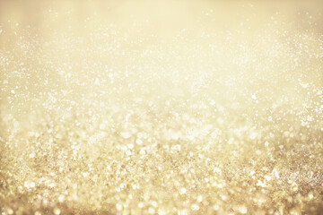 Gold light Festive Christmas background. Abstract twinkled bright background with bokeh defocused golden lights