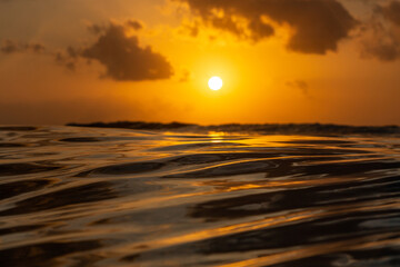 Golden sunset in tropical island Bali from the ocean