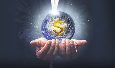 Businessmen hold the world with the concept of global connection. Finance and energy saving concept.Elements of this image are decorated by NASA