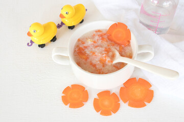 mix rice gruel and carrot healthy foods health care for baby eats breakfast with duck toy...