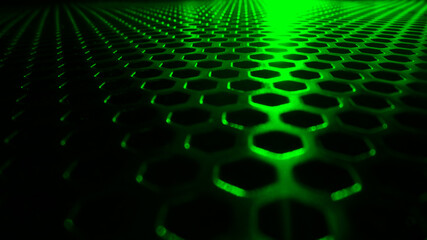 Surface with green hexagon holes. Selected focus. Great for design backgrounds