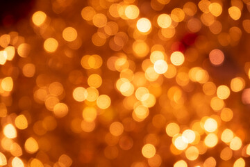 Christmas and new year lights. Blurred lights of orange color. Can be used as background and texture