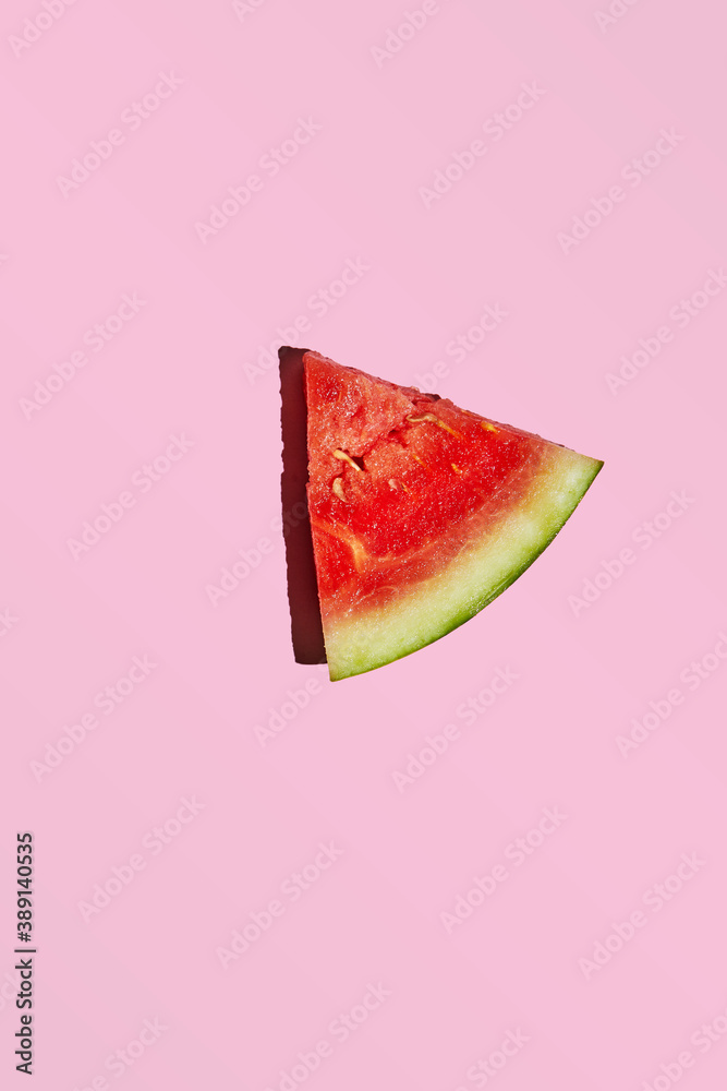 Sticker Slice of Mini Watermelon isolated on pink background with hard shadow