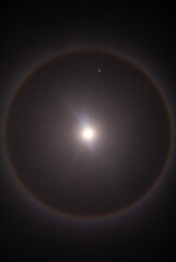 Full moon with a halo of light and very close the planet Mars, lunar rainbow with the blue moon