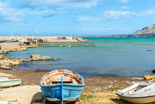 Seaside landscape with small port and old boats in Trappeto, province of Palermo, Sicily, Italy.