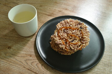 Thai sweet dessert crispy rice cracker with sugar cane baking watermelon juice dressing caramel on plate
