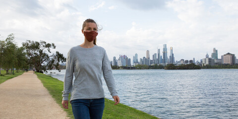 Young Woman Wearing Face Mask Walking Around Albert Park Lake Melbourne Australia