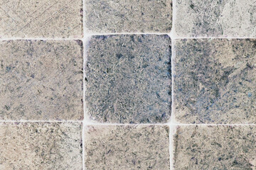 Light pale stone background with inverted colors. Beige with blue backdrop or wallpaper. Rough matte surface. Pattern of scratches, blotches and processing marks