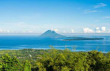 View of Manado Tua mountain and Bunaken Island from Tumpa Mountanin. Manado Tua Mountain and Bunaken Island is landmarks and popular tourist destination in Manado, Indonesia.