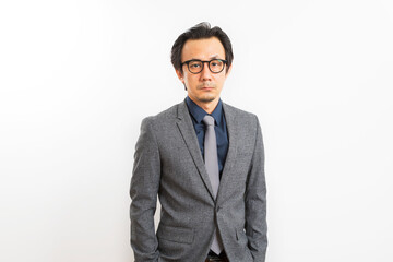 Successful Asian business man in suit and tie with confidence gesture on white background.