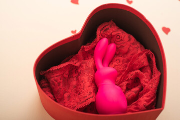 Rabbit vibrator and lingerie in a heart shaped gift box. The best gift for a woman