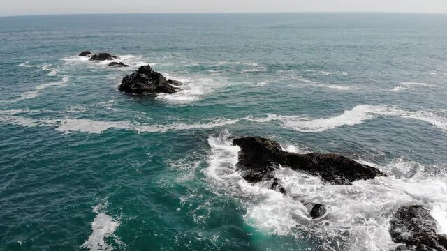 Aerial view of ocean waves and fantastic Rocky coast
